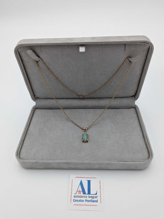Necklace, Jade cabochon with a single diamond, set in 14K Yellow Gold with 14K Yellow Gold Rope chain.